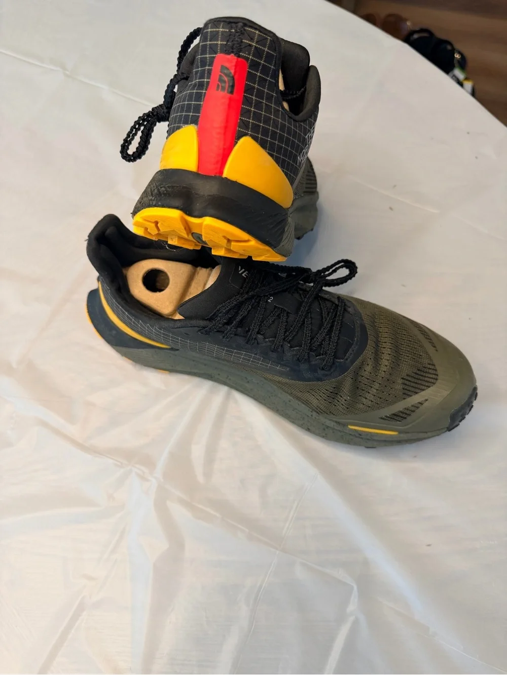 The North Face Men's Black and Olive Trail Shoes with Yellow and Red Accents